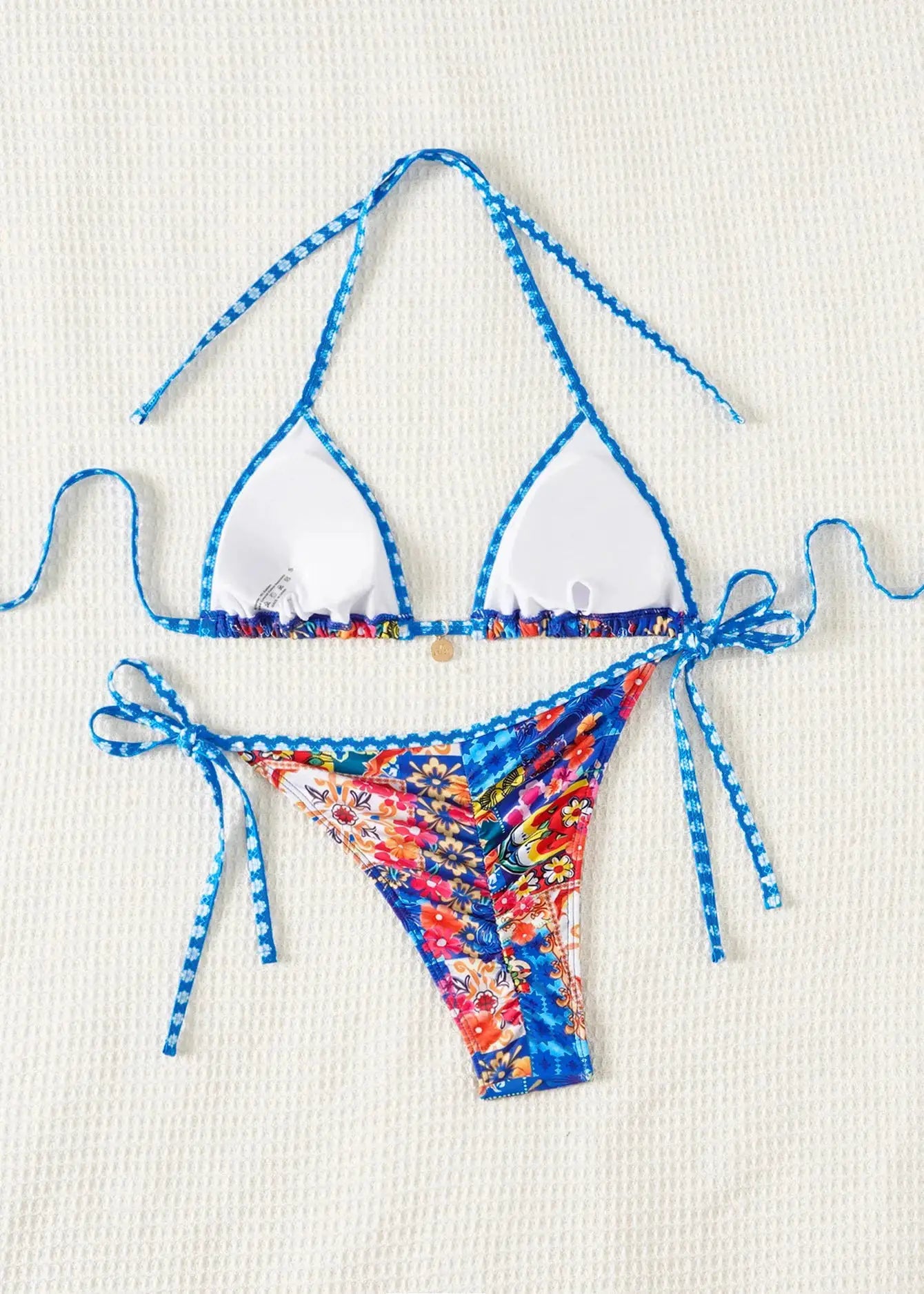 Triangle bikini set by Simples Market, floral print push-up top with white cups and blue trim, Brazilian bottoms.