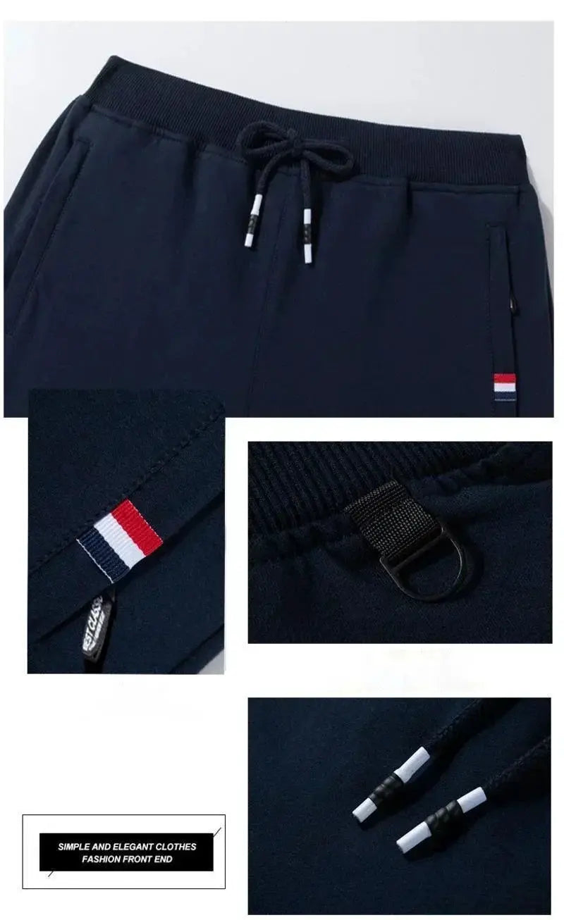 Navy men's jogger track pants by Simples Market with elastic waist, drawcord, zip pockets, stripe detail