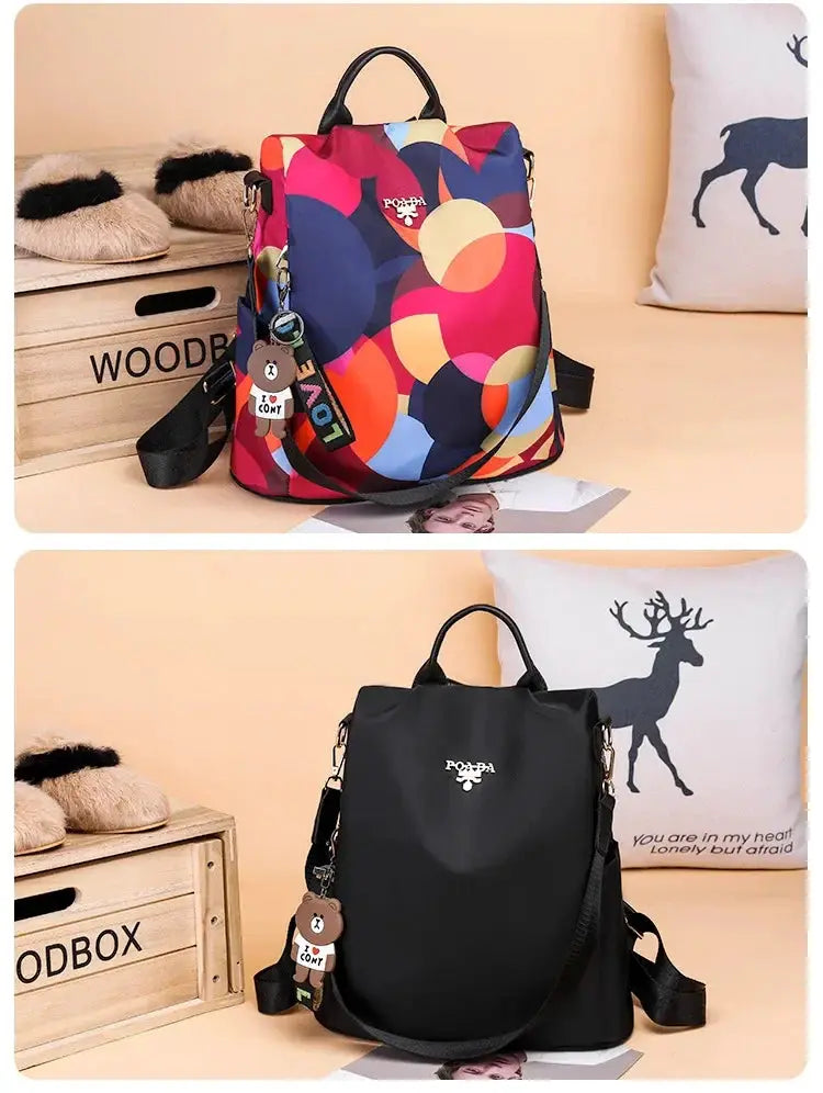 Two Simples Market women's Oxford cloth backpacks; multicolor print and black, large-capacity travel bags.
