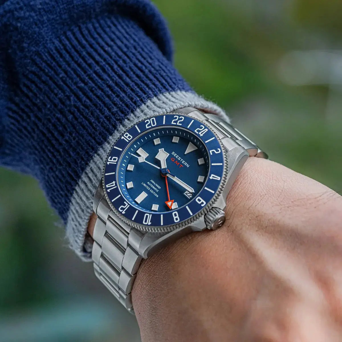 SEESTERN Diver watch on stainless steel bracelet with blue dial, blue GMT bezel, orange GMT hand, sapphire crystal