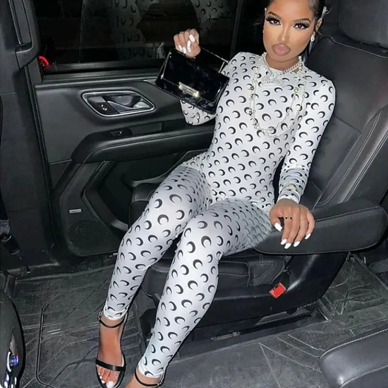 Women's round-neck moon-print gray jumpsuit with long sleeves and slim fit.