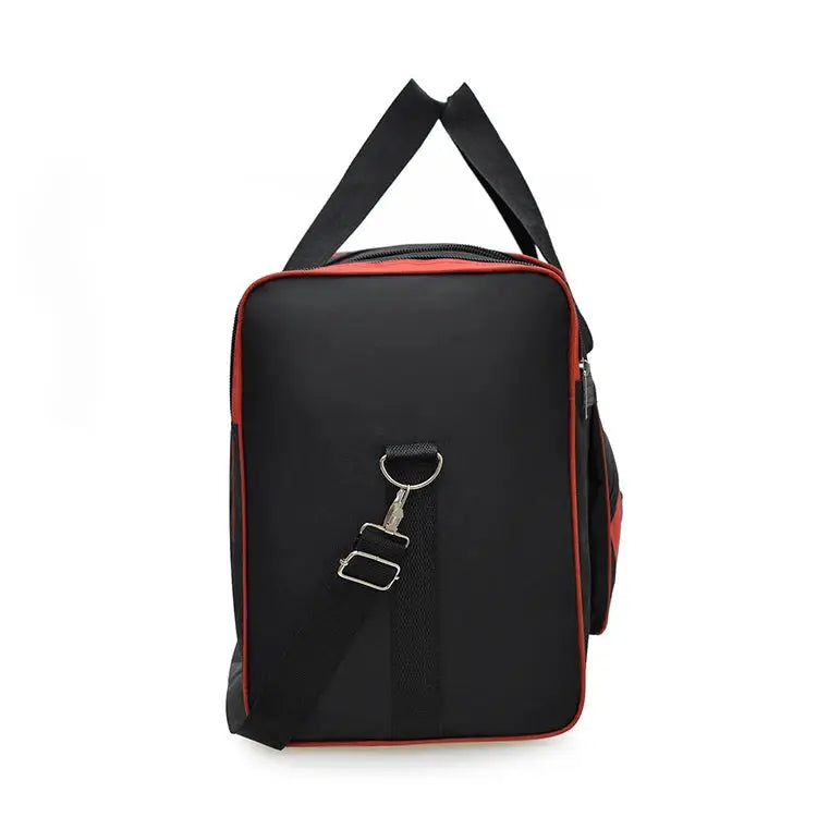Oversized black handbag with red piping and adjustable shoulder strap