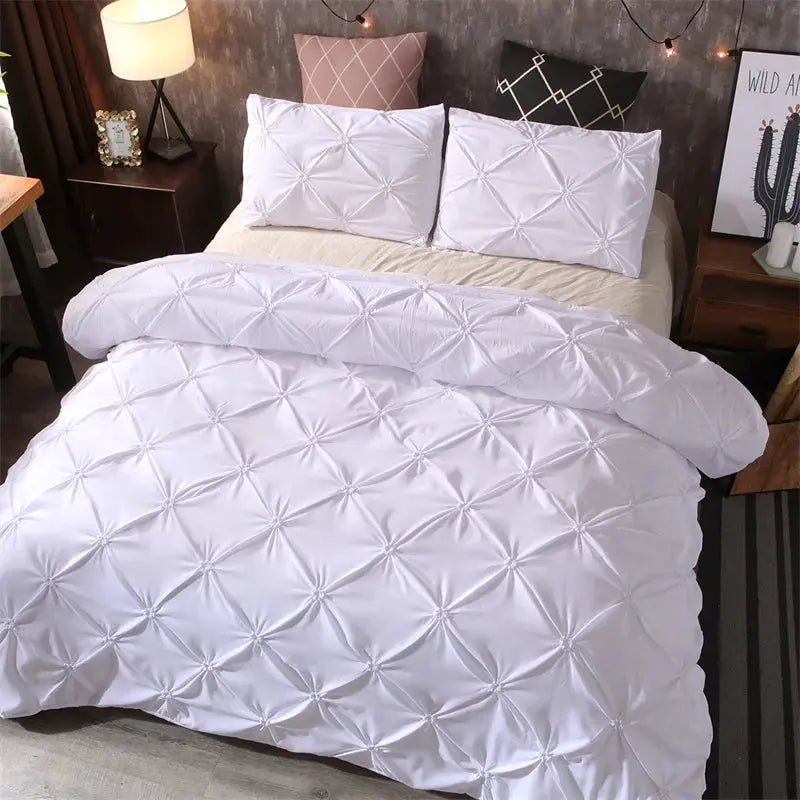 Queen Comfort Set white quilted duvet cover and two pillowcases.