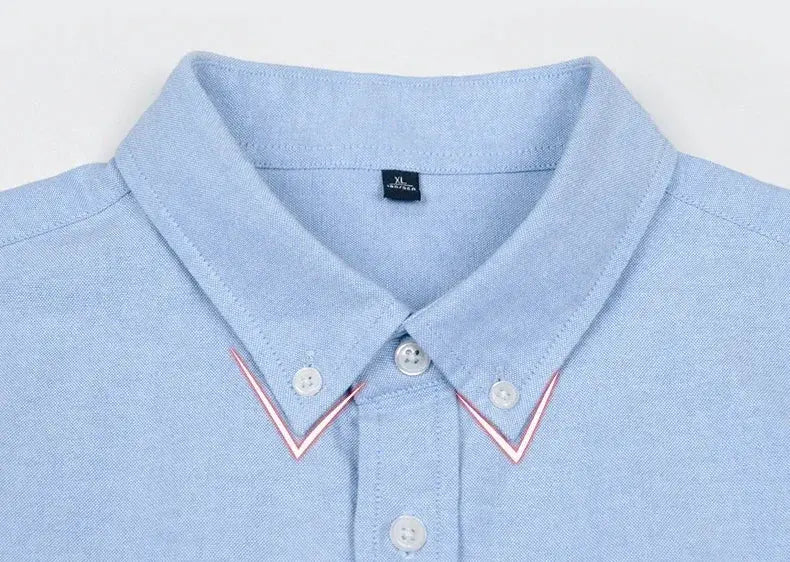 Men's slim-fit oxford cotton shirt in light blue with long sleeves, button-down collar and red trim accents