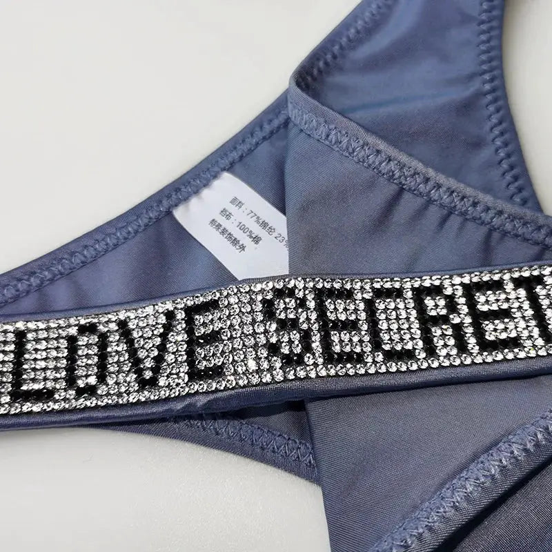 Low waist thong with rhinestone-studded blue waistband.
