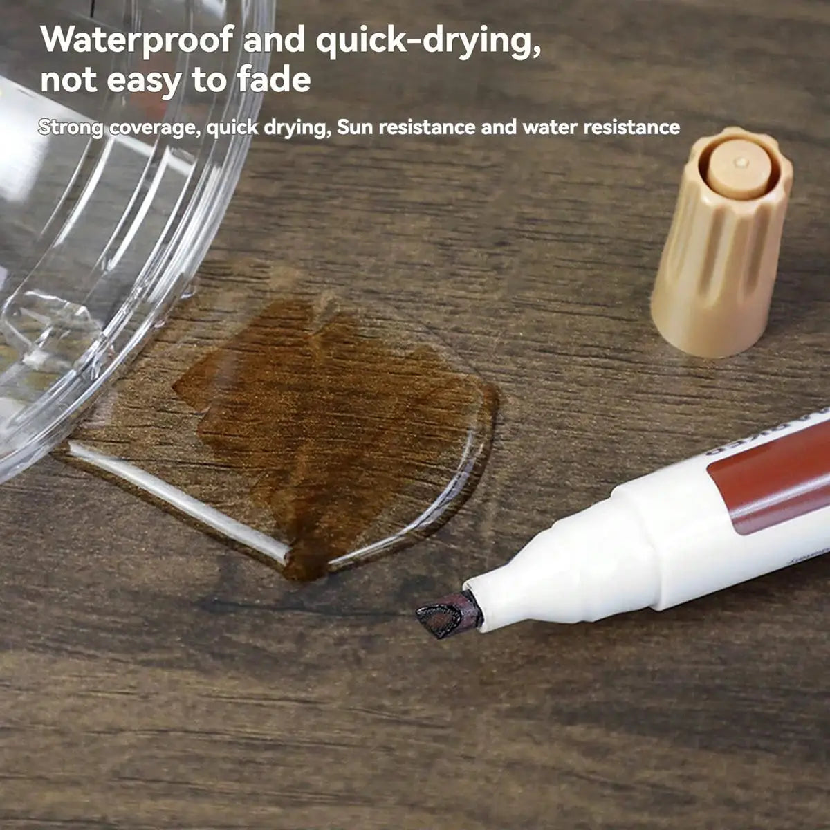 Furniture touch-up marker kit with brown marker and beige cap on wood surface