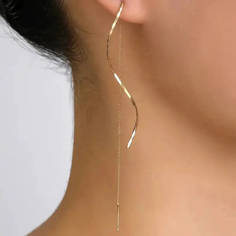 Earrings gold-tone threader with curved bar and long chain drop.