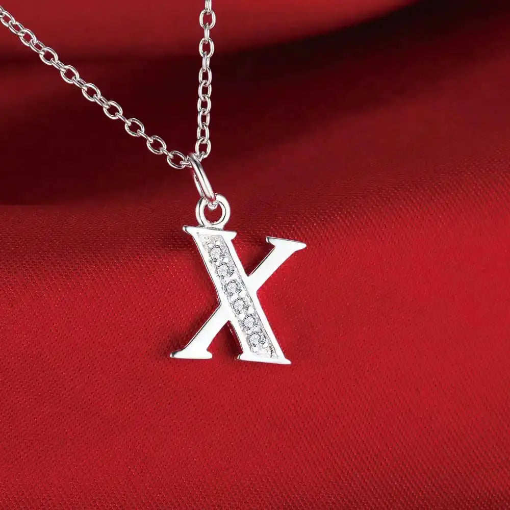 X-shaped 925 sterling silver necklace pendant with embedded zircon stones on a silver chain