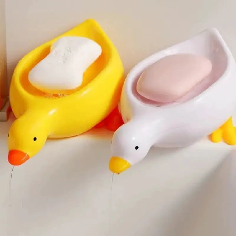 Duck-shaped self-draining soap trays by Simples Market, yellow and white, two-pack for bathroom.