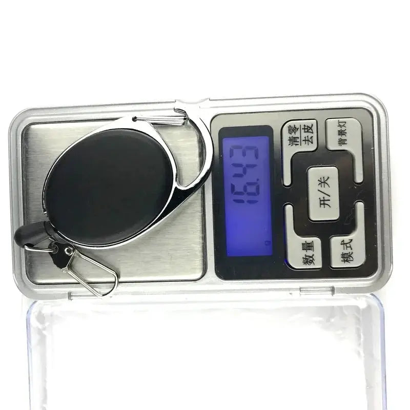Black retractable badge reel with metal casing and quick-release spring clip