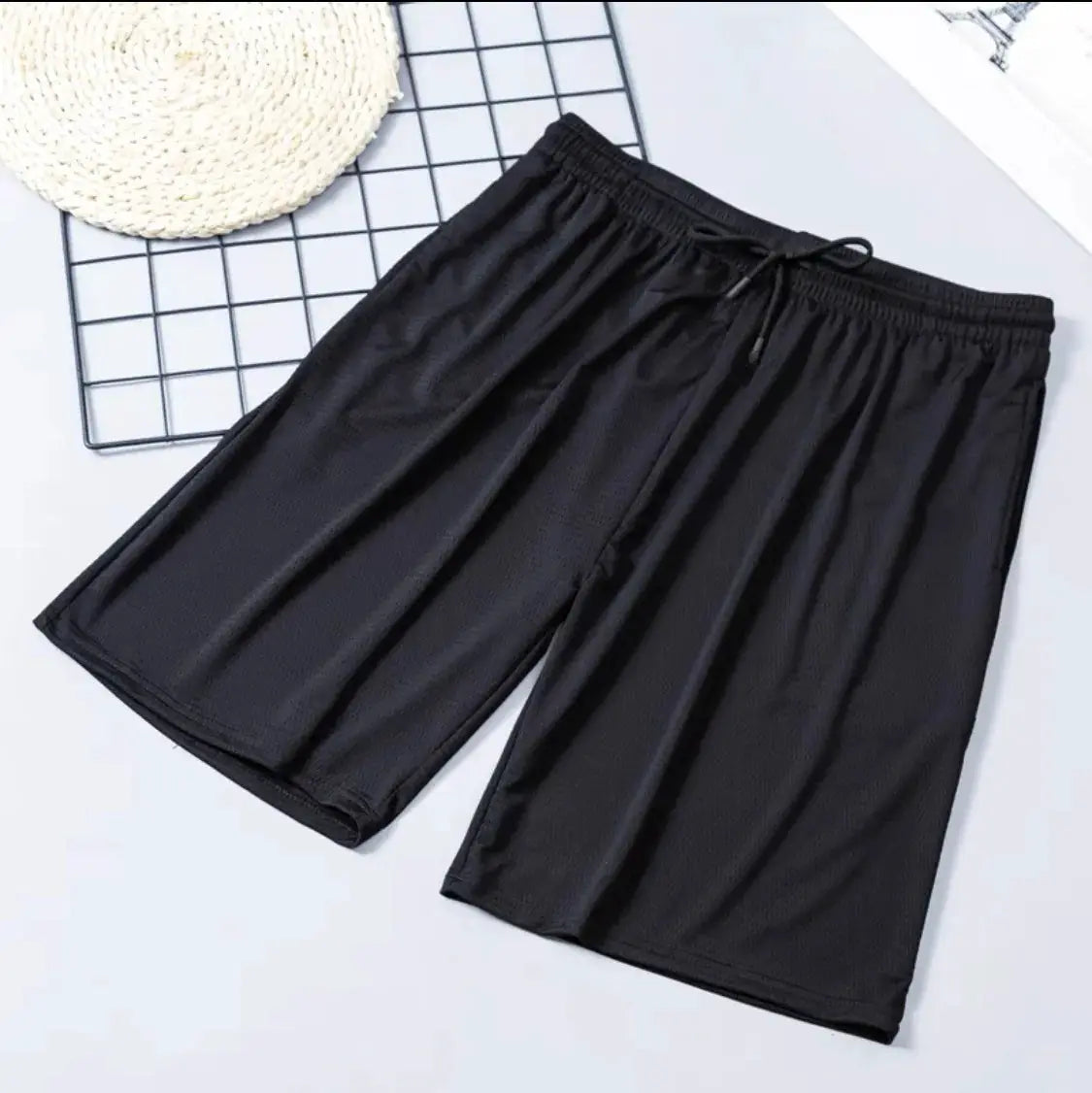 Simples Market men's black mesh sports shorts with drawstring waist, quick-dry fabric.