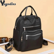 Backpack by Yogodlns, black waterproof Oxford travel bag with large-capacity zipper compartments