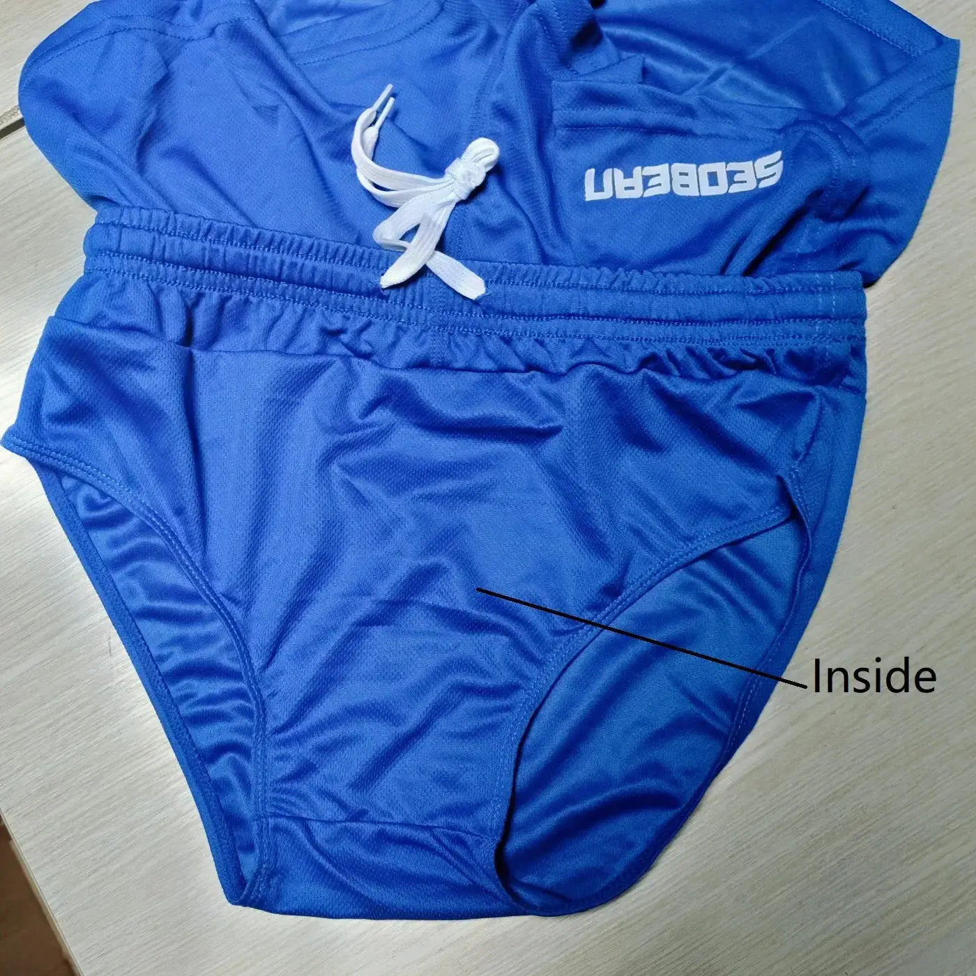 SEOBEAN men's blue running shorts with inner shorts and white drawstring; logo visible.