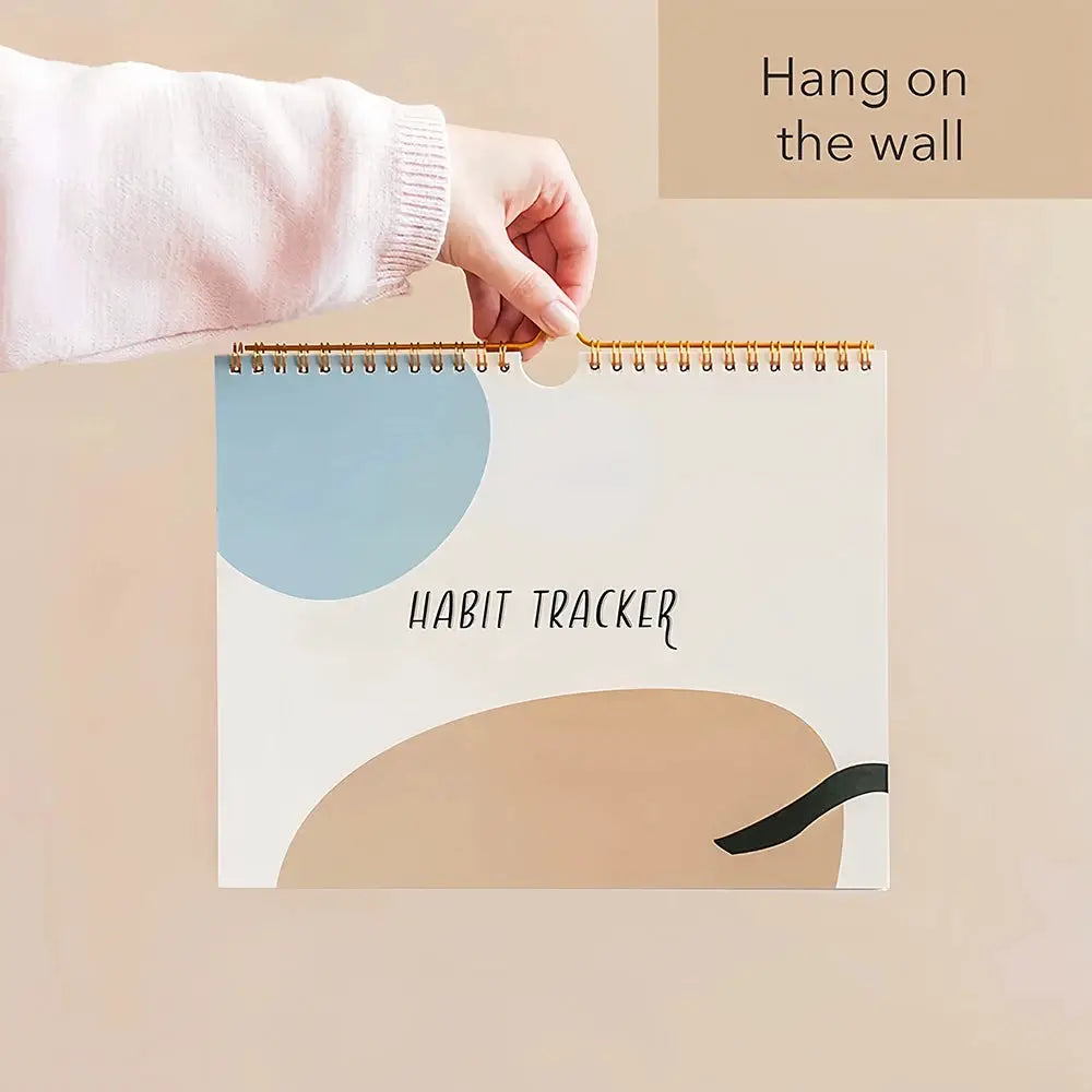 Habit Tracker spiral-bound calendar journal with abstract blue and beige cover