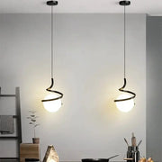 Nordic LED pendant light pair with black curved metal arms around white glass globes, hanging from cords