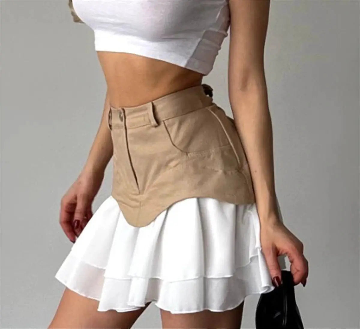Chic Ruffles women's high-waisted skirt with beige waist belt overlay over white layered hem