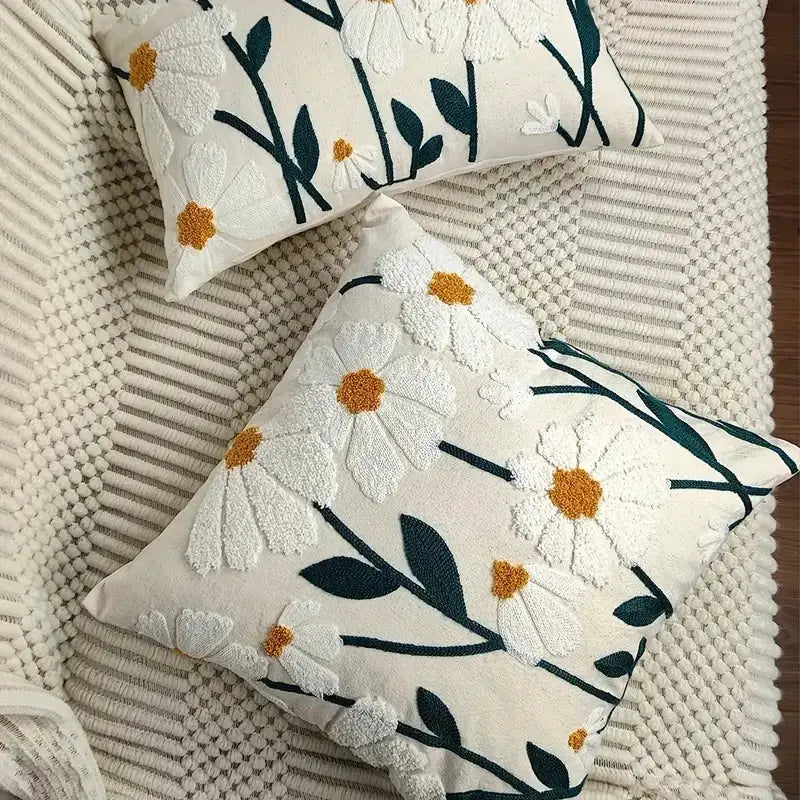 Simples Market pillow covers; 2 cream cotton covers with embroidered boho floral pattern, teal stems, yellow centers.