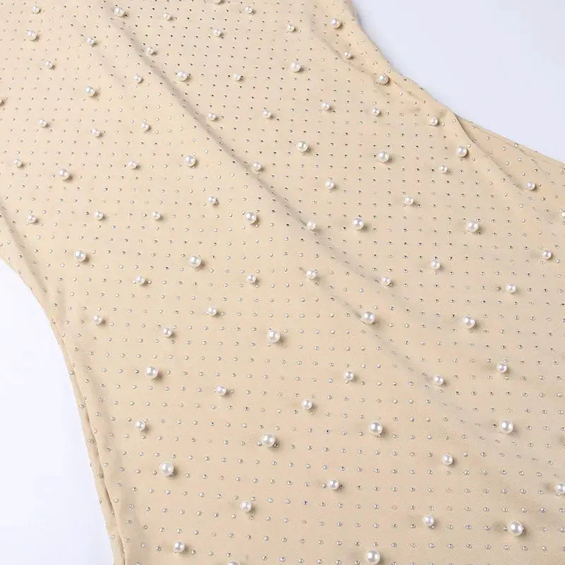 Apricot beaded mesh jumpsuit fabric with pearl embellishments by Simples Market