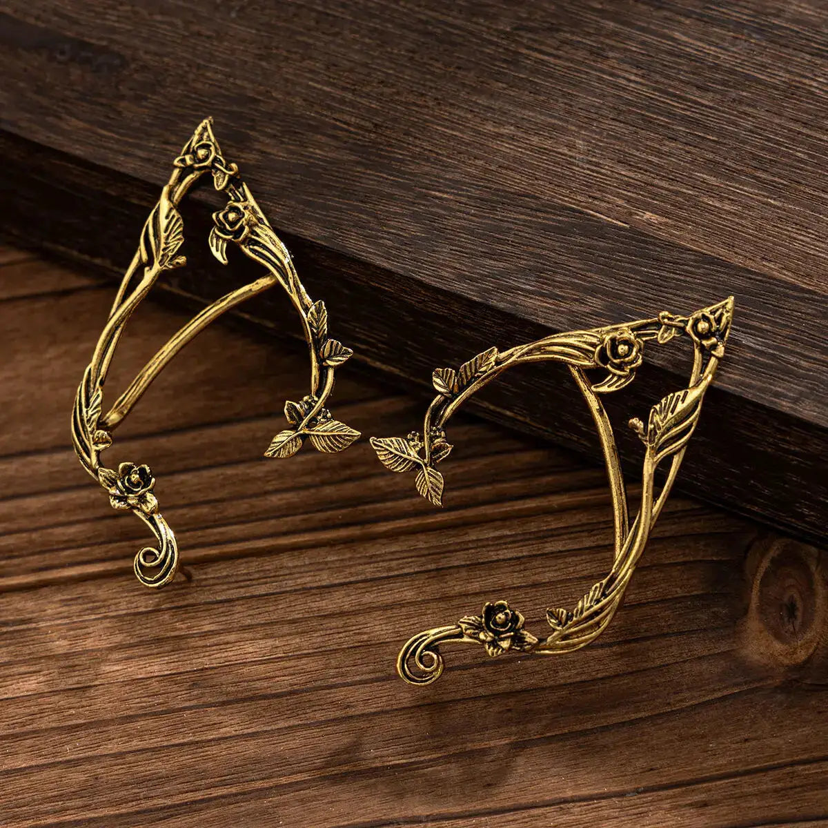 Pair of gold-tone elf leaf ear clips by Simples Market, wedding fairy jewelry
