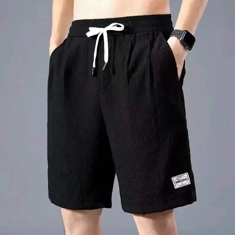 Men's black ice-silk casual shorts with a white drawstring and side pockets.
