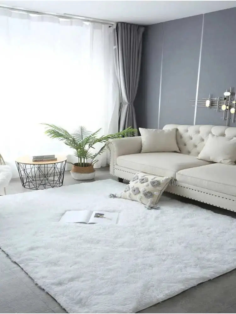 Kids white fluffy rug, large soft carpet in a modern living room with a beige sofa and plants.