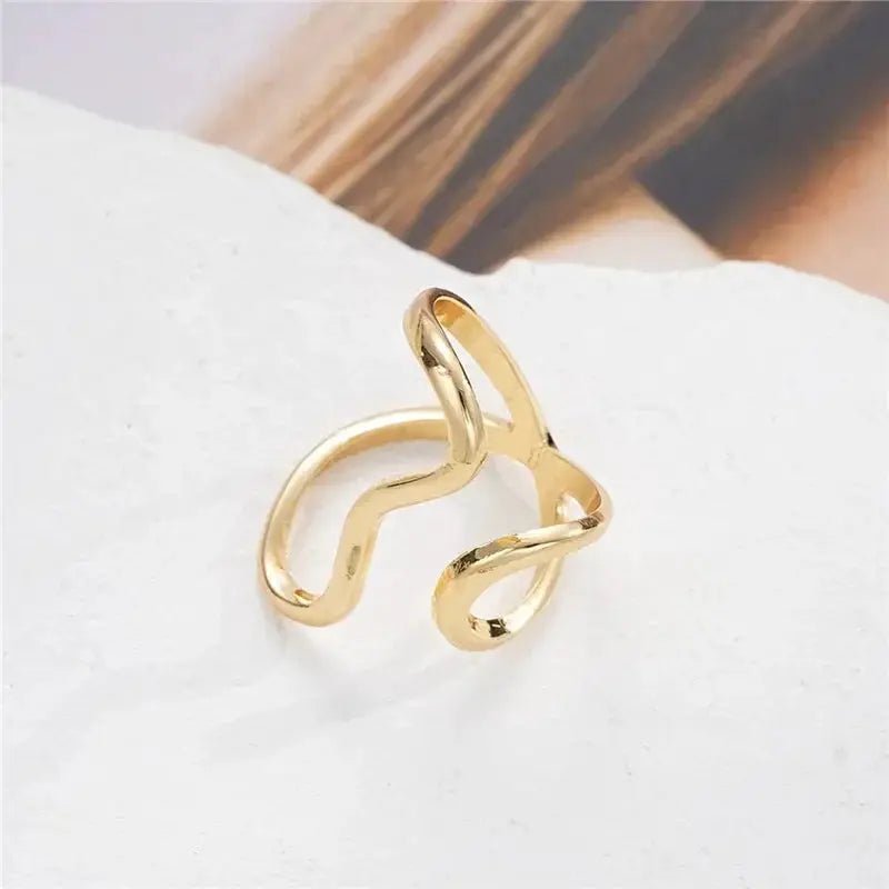 Ring by Simples Market: irregular gold-tone stainless steel open-loop design