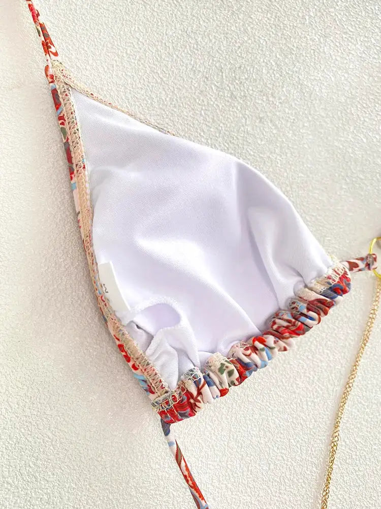 Triangle bikini top with white lining and multicolor floral-printed ruched edges and tie straps