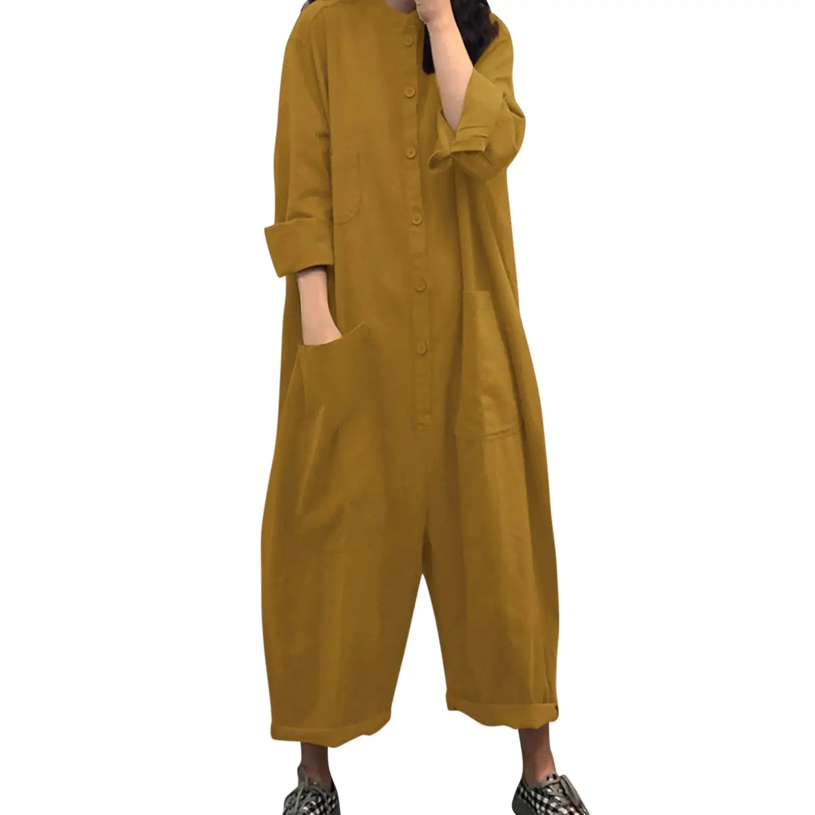 Pocket jumpsuit for women by Simples Market in mustard yellow, loose casual fit with long sleeves and front buttons.