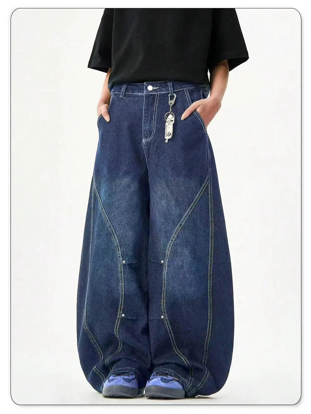Men's blue denim wide-leg baggy jeans with curved stitched panels and balloon silhouette