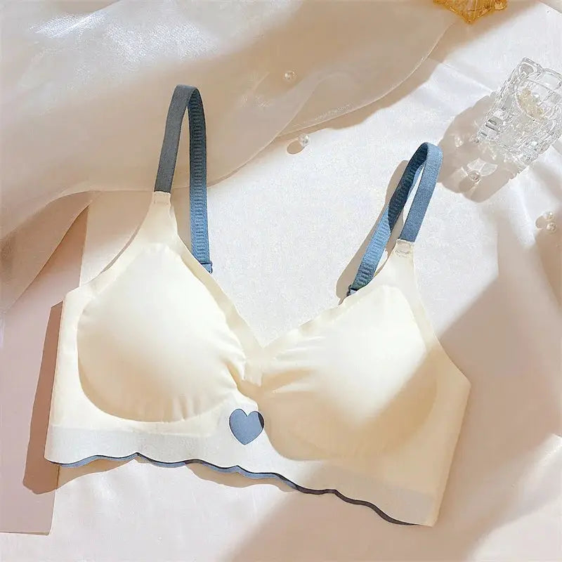 Push-up bra for women by Simples Market, white cups with blue straps and blue heart detail, seamless wireless lingerie.