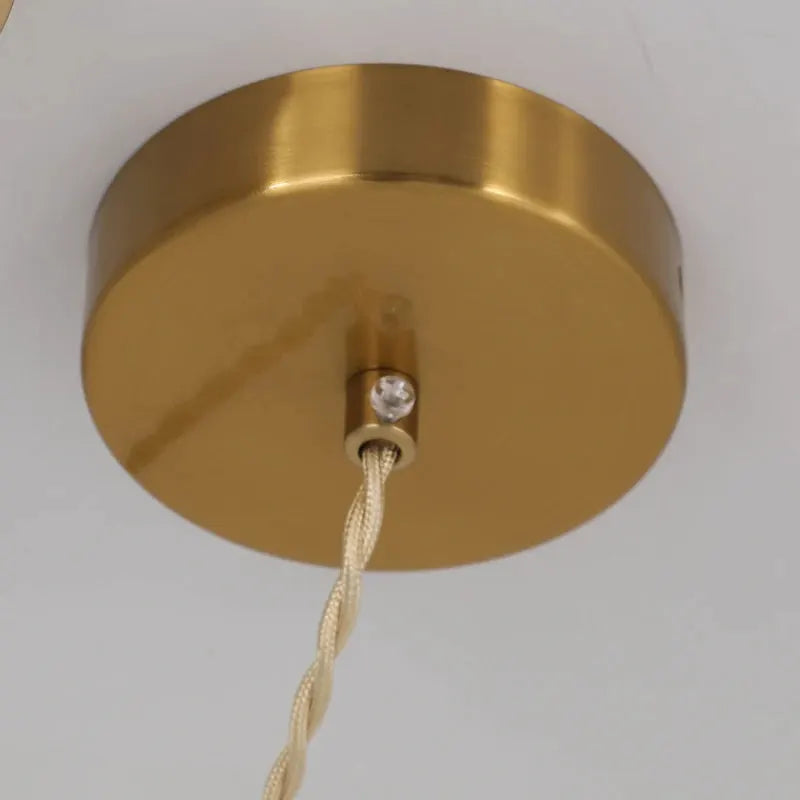Ceiling pendant light in bronze with white braided fabric cord and round canopy