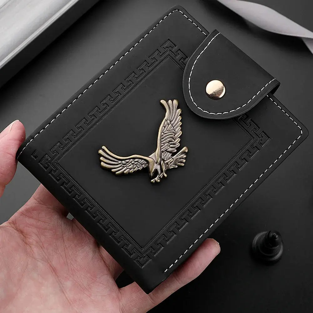 Simples Market men's short PU leather wallet with gold eagle emblem, black with white stitching and snap flap