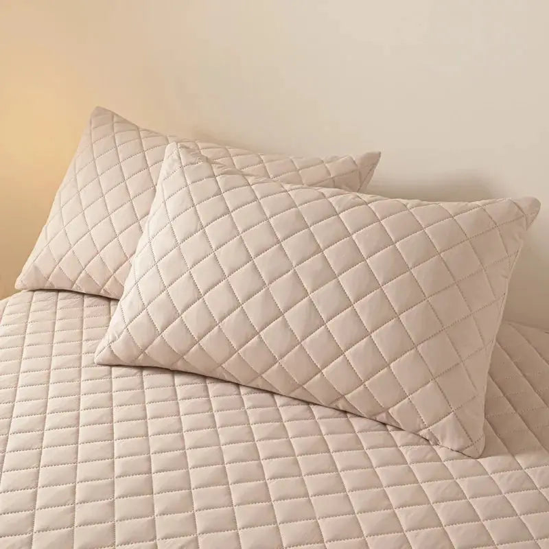 Quilted beige cotton pillowcase pair by Simples Market with diamond stitching