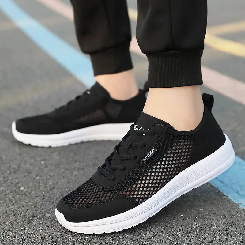 Men's breathable mesh running shoes by Simples Market, black with white sole, lightweight outdoor sneakers pair