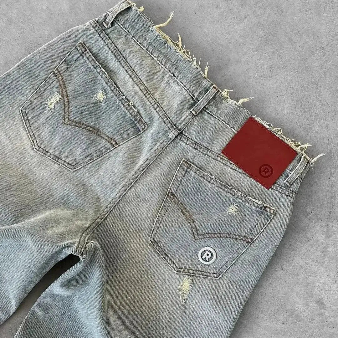 Simples Market men's straight distressed jeans, light washed denim with ripped holes, back pockets and red brand patch