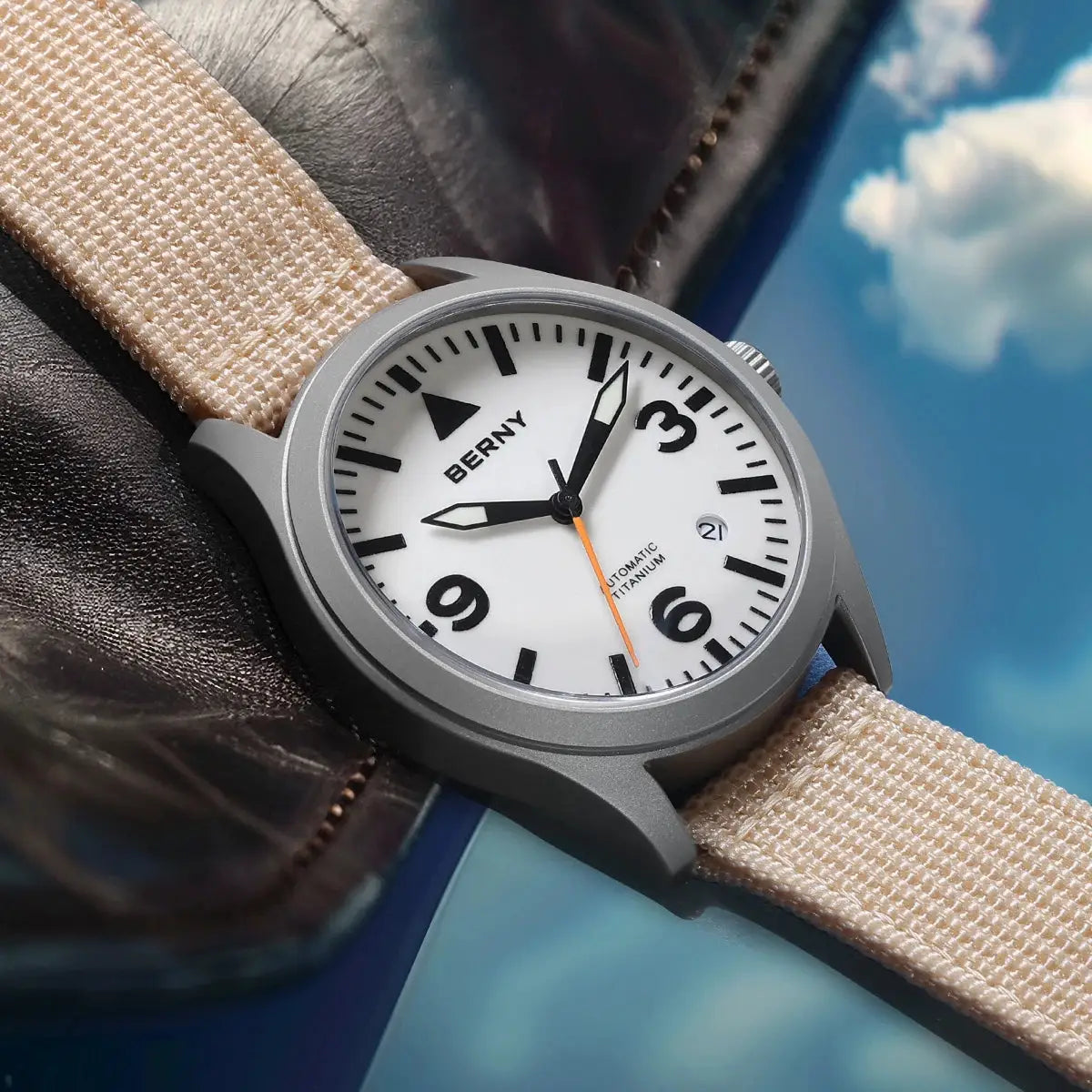 BERNY titanium automatic men's watch with white dial, black numerals, orange second hand, beige fabric strap