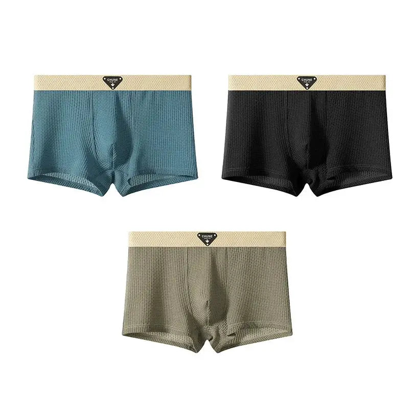 3-pack men's boxer shorts in teal, black, and olive with beige waistband and mesh-textured fabric by Simples Market