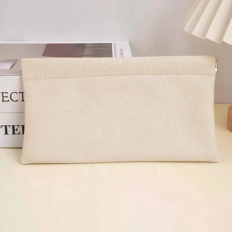 Self-closing artificial leather long wallet by Simples Market in cream with top zipper closure