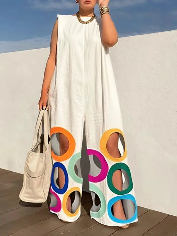White sleeveless wide-leg jumpsuit with colorful rainbow circular cutouts along the lower legs