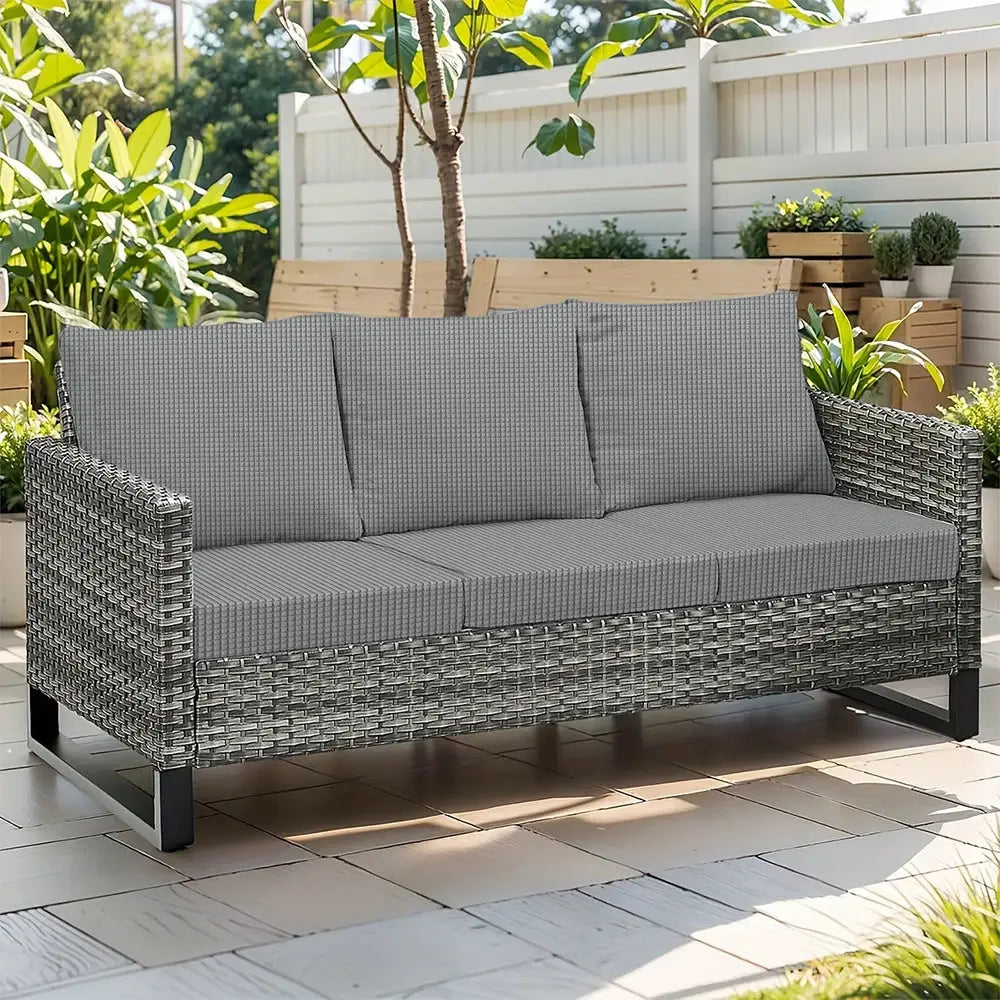 Waffle jacquard patio sofa with gray cushions on a wicker frame
