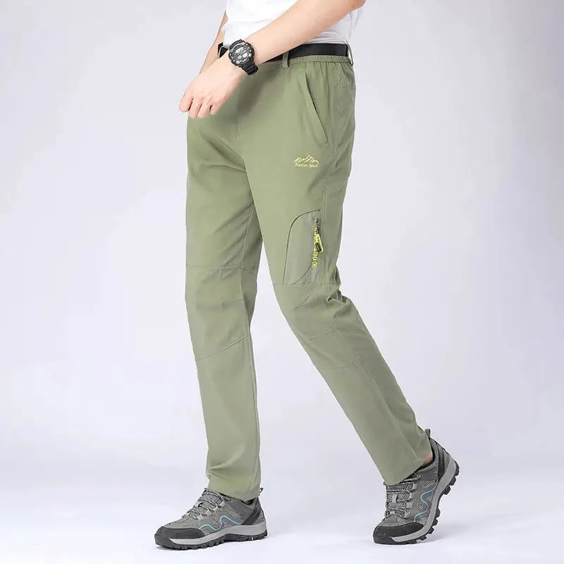 SFABL 5XL hiking pants by Simples Market; olive green quick-dry, lightweight waterproof cargo trousers with zip pockets.