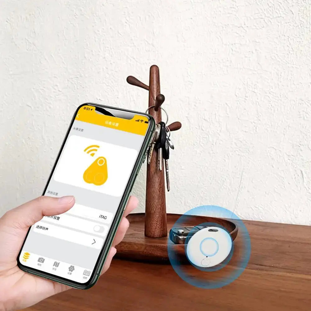 Cat Dog GPS Bluetooth 5.0 tracker; round white device with blue ring shown with keys and phone app