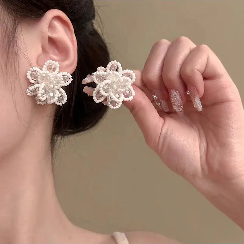 Pair of white pearl flower earrings with crystal zircon petals, elegant stud jewelry for weddings and parties