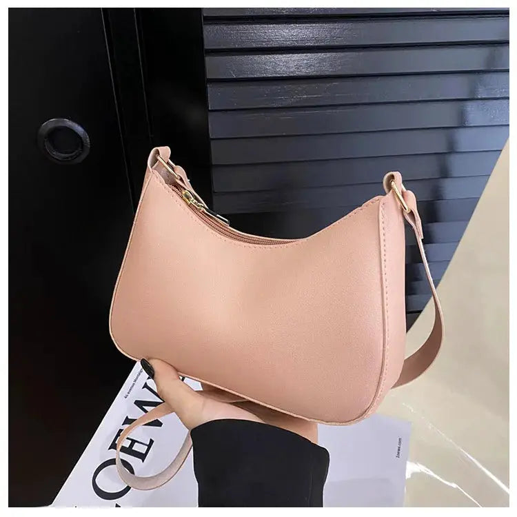 Small pink square shoulder bag by Simples Market with gold hardware