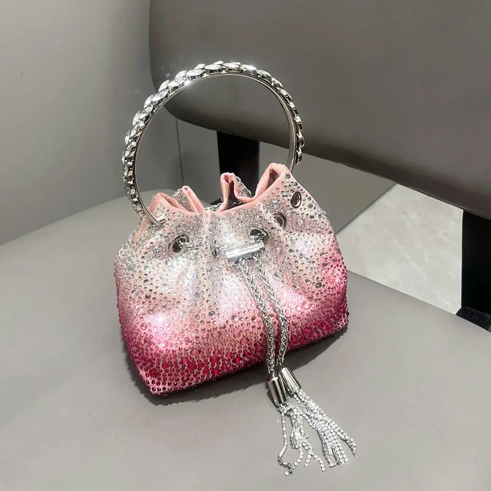 Simples Market rhinestone evening clutch bag with pink gradient crystals, crystal-embellished hoop handle and tassel