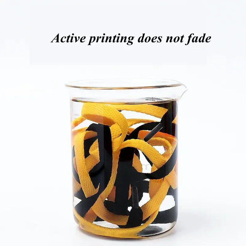 Simples Market flat shoelaces, 1 pair, black and yellow, casual athletic shoe strings in a glass jar
