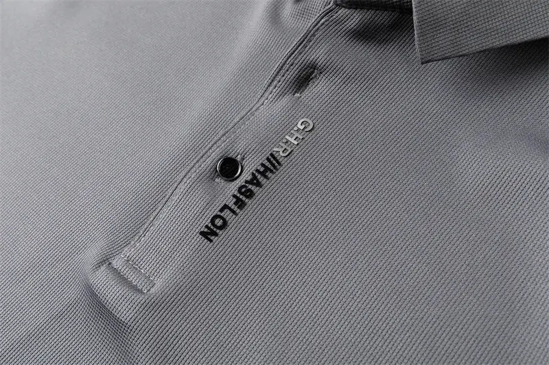 Men's grey long-sleeve polo shirt with badge, breathable and versatile.
