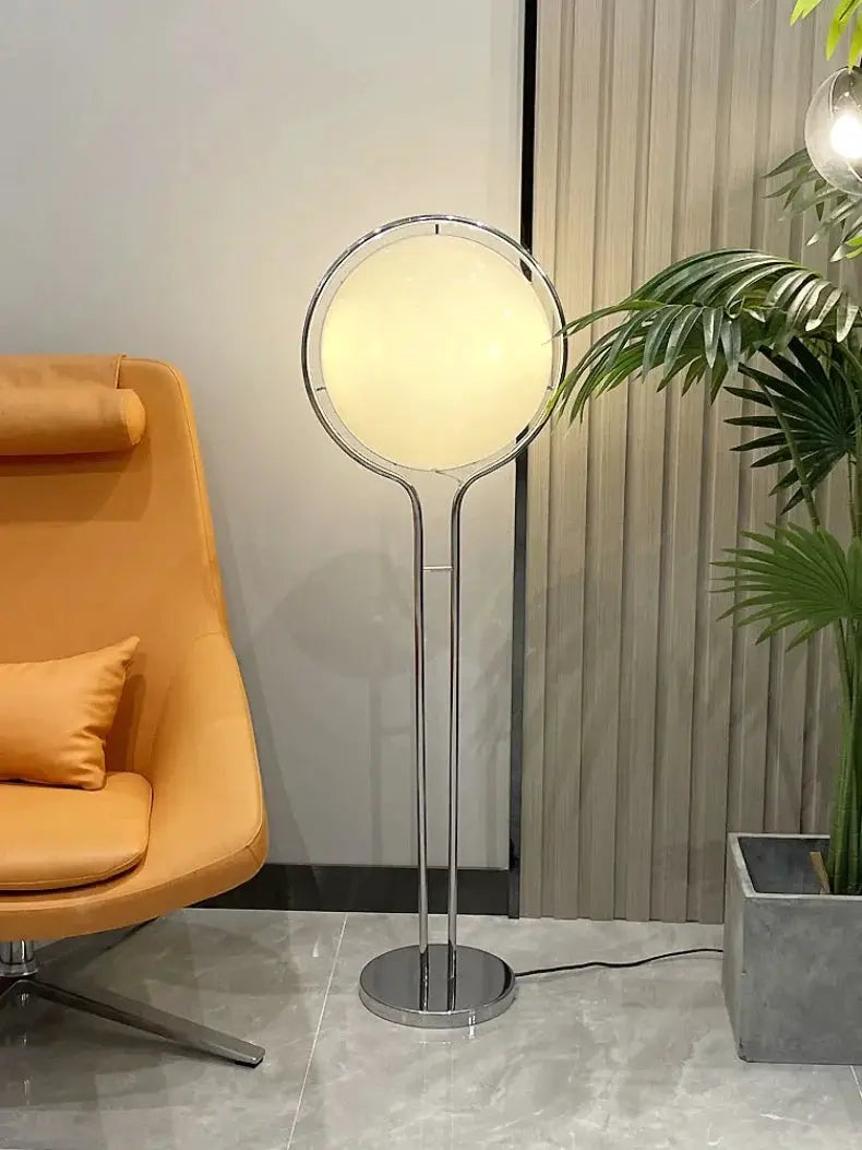 Modern white acrylic circular LED floor lamp with chrome stand by Simples Market