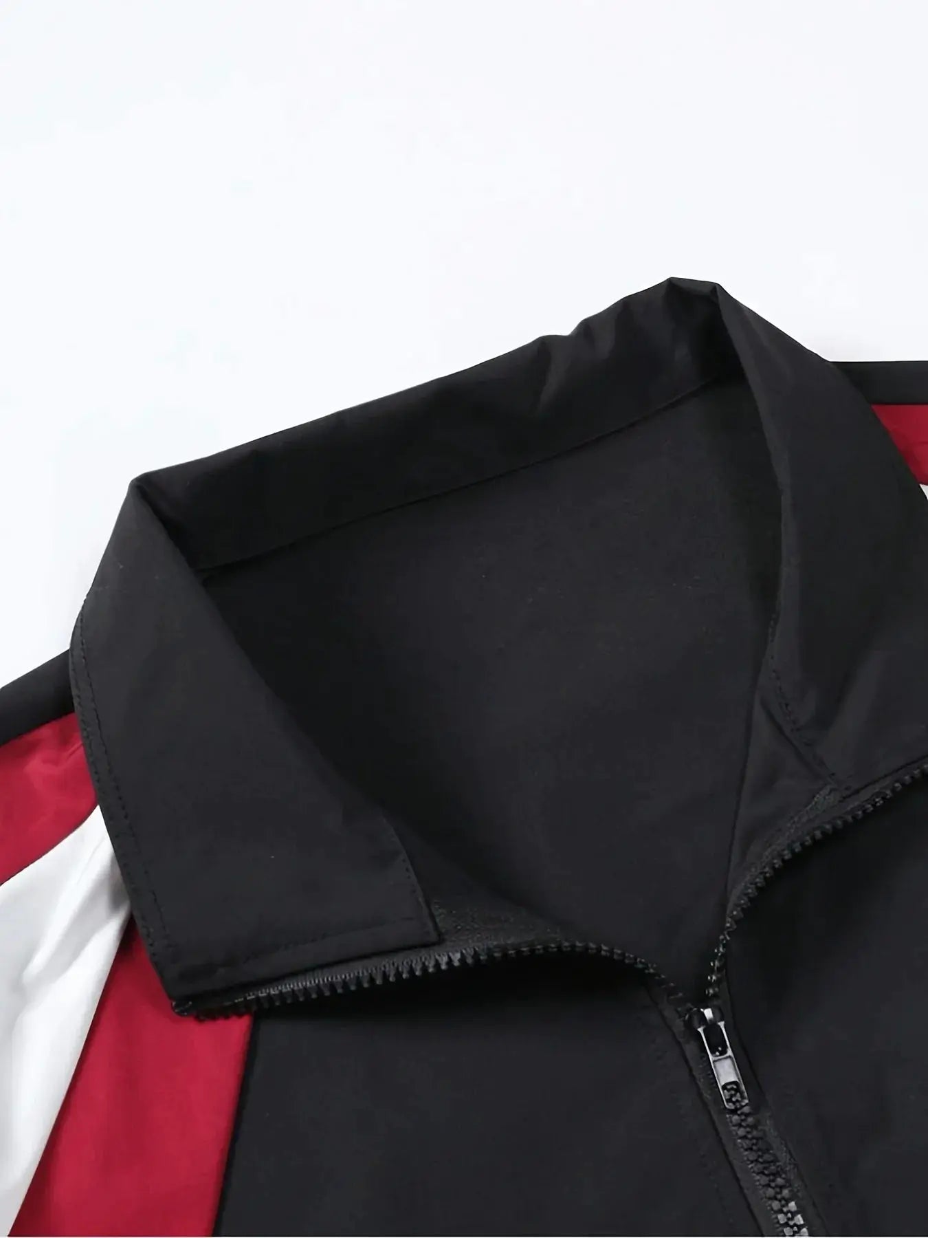 Men's color-blocked jacket by Simples Market, black exterior with red lining, lightweight windproof.