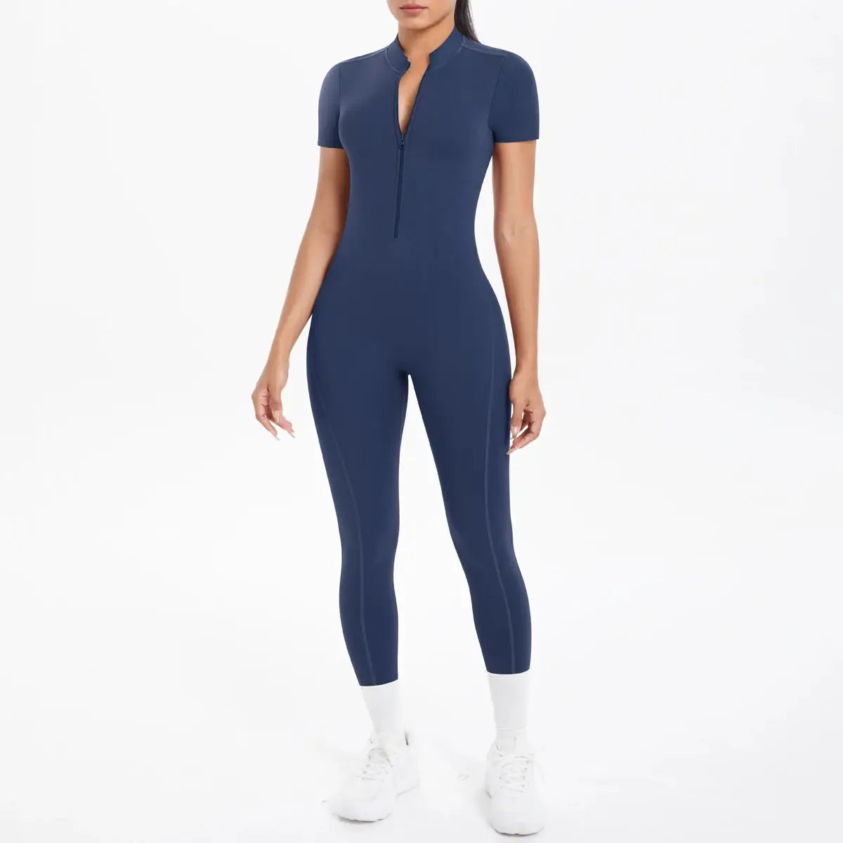 Women's navy blue short-sleeve fitness jumpsuit with front half-zip, body-hugging one-piece.